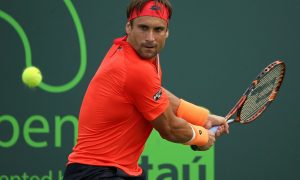 KEY BISCAYNE, FL - MARCH 28:  David Ferrer of Spain plays a match against Federico Delbonis of Argentina during Day 6 of the Miami Open presented by Itau at Crandon Park Tennis Center on March 28, 2015 in Key Biscayne, Florida.  (Photo by Mike Ehrmann/Getty Images)